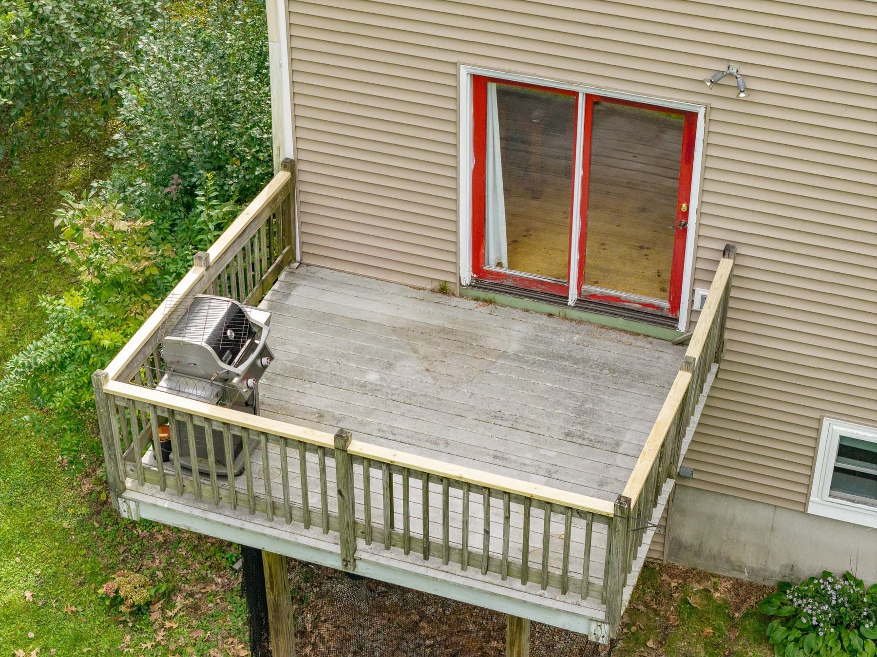 The deck off the dining area slider, with the grill, seen from above